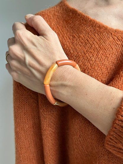 Bracelet rosé avec touche d'orange